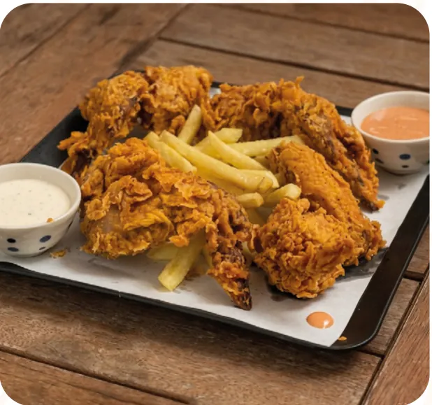 Fried chicken wings with fries and dips